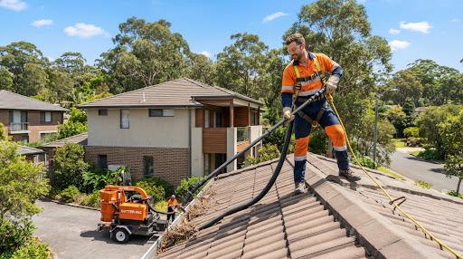 Hills Gutter Cleaning team operating roof vacuum safety harness in Castle Hill